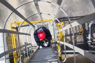 Male climb the ladder tank © chitsanupong