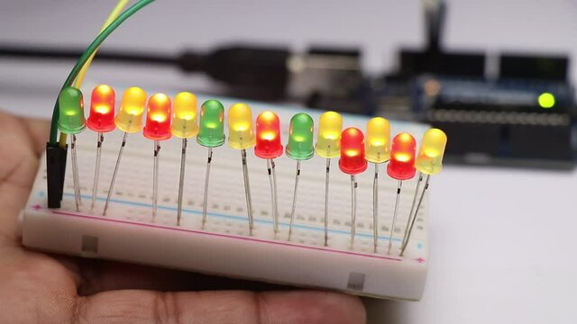 Glowing LED bulbs connected to breadboard controlled by micro controller