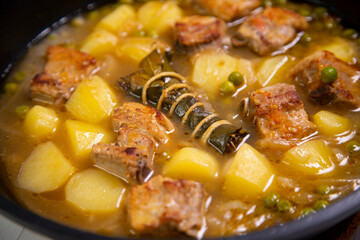 Pork stew with peas and potatoes. Traditional tapa from the north of Spain.