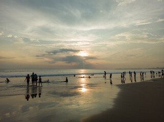 Fototapeta na wymiar reflection of sunlight and shadows of people on Petitenget beach, Kerobokan, bali