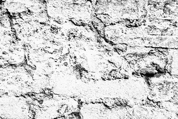 Fototapeta premium Texture of a brick wall with cracks and scratches which can be used as a background