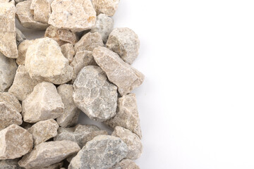 Gray small rocks ground texture isolated on white background. Small road stone.