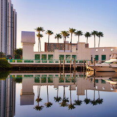 country sunny isles florida travel vacation hotel beautiful cute reflections lake water boat palms tropical sky blue building 