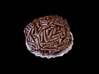 Brazilian chocolate ball known as Brigadeiro. close-up shot isolated on black