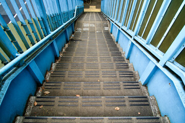 Fototapeta premium The blue stairs of pedestrian bridge.