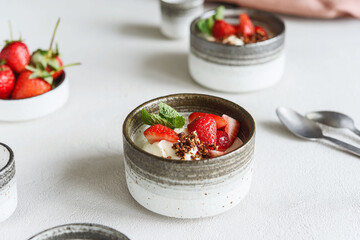 Strawberry, cream cheese and feta cream and crumble crust dessert. Homemade Sweet and salty cheesecake. Trifle. Selective focus