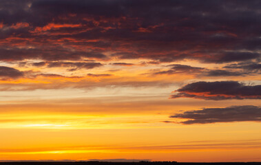 Fototapeta premium The evening sunset. Panorama. Majestic Storm Clouds. Tragic gloomy sky.