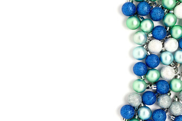 Multicolored Christmas balls on a white background. Holidays concept with copy space.