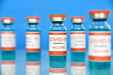 Coronavirus vaccine injection in glass bottles.