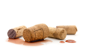 Wine corks with drop red on white background.