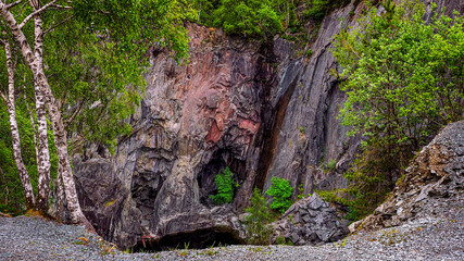 Hodge Close Quarry is a dramatic example of man's influence upon the Lake District landscape, featuring a huge cavern with a water filled bottom