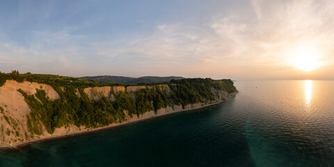Aerial view about the moon bay slovenia. Unique beach in adriatic sea near by Piran city. Beautiful untouchable nature. It has only one way down to the beach.