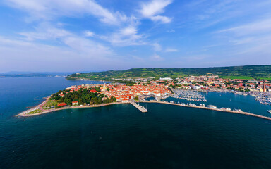 Fototapeta premium Aerial cityscape about Izola town Slovenia. Unique mediterranic cute little town in adriatic sea near by Piran city.
