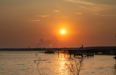 Obraz premium sunset over the river