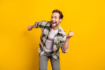 Fototapeta na wymiar Photo of cheerful young positive happy man dance good mood funky funny isolated on yellow color background