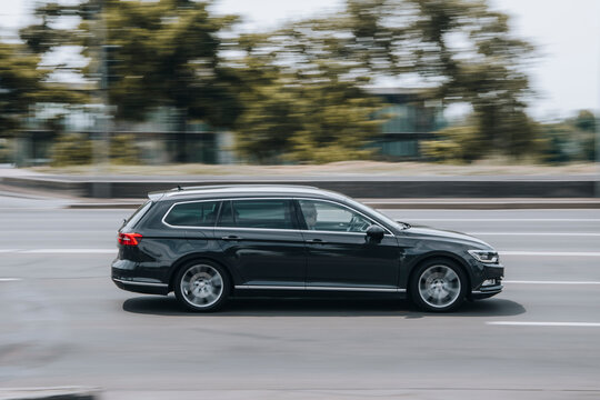 Ukraine, Kyiv - 27 June 2021: Black Volkswagen Passat car moving on the street. Editorial