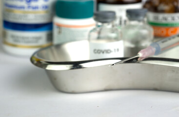 Fototapeta na wymiar Syringe close up with medicine background.