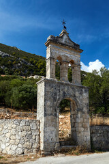 Fototapeta na wymiar Ruined stone belfry of an orthodox chapel in Zakynthos island