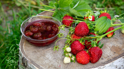Strawberry jelly, jam on a wooden background, environmentally friendly product.