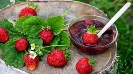 Strawberry jelly, jam on a wooden background, environmentally friendly product.