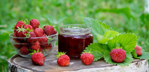 Strawberry jelly, jam on a wooden background, environmentally friendly product.
