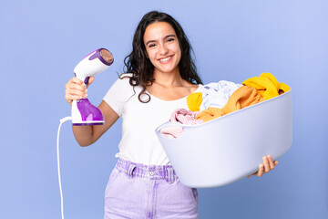 hispanic pretty woman with an iron steam and clothes