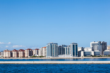 Multi-storey houses on the coast, near the port of Gibraltar.