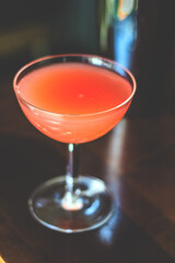 Red cocktail in a fany glass