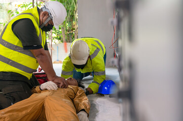 Safety team CPR for first aid electrician worker accident electric shock unconscious. Asian electrician worker accident electric shock unconscious in site work.	 - obrazy, fototapety, plakaty