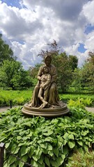 Obraz premium Sculpture in honor of the grandmother A.M. Hannibal and grandson of A.S. Pushkin surrounded by greenery 