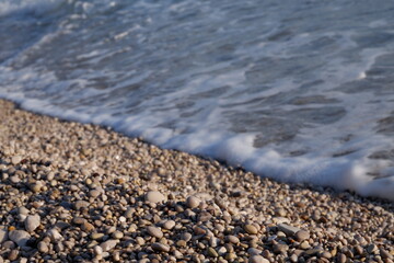 close up shot with small stones at beach