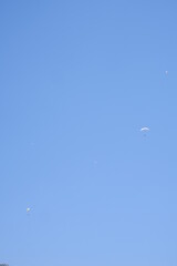 hills view with clouds paragliders flying 