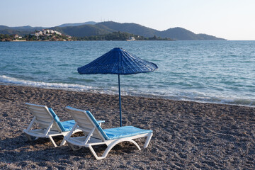 beach chairs and umbrella