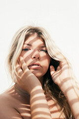 Fototapeta premium attractive plus size young woman outdoors portrait with tropical shadows