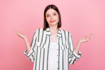 Photo of cute brunette young lady shrug shoulders wear white shirt isolated on pink color background