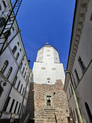 The courtyard of the Vyborg Castle and the entrance to the St. Olaf Tower in the city of Vyborg...