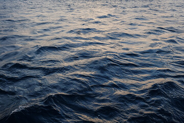 Deep blue sea with waves ripples in the evening