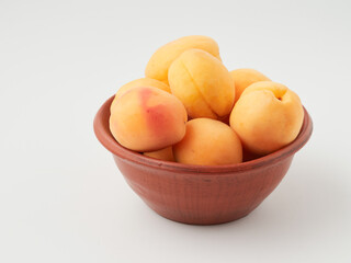 Naklejka na ściany i meble Apricot isolate. Apricots with slice on white. Fresh apricots. With clipping path. Full depth of field.
