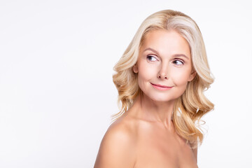 Portrait of attractive curious healthy grey-haired woman looking aside copy blank space healthcare isolated over white color background
