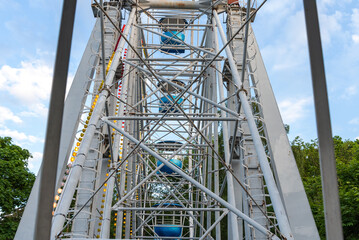 View of Inside of Ferris Wheel view of the structure with cabins.