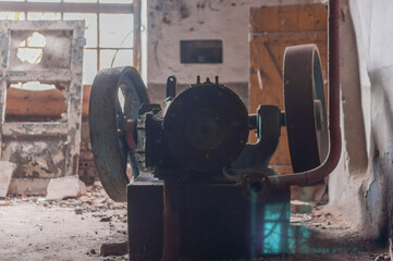 The steam engine in abandoned distillery next to the palace