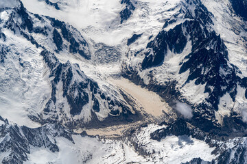 melting glacier in alps aerial view