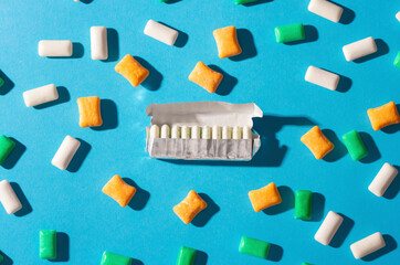 Multi-colored chewing gum on a blue background