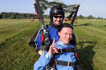 Skydiving. Tandem jump. The tandem just landed on the field. © Sky Antonio