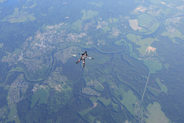 Skydiving. Solo girl is flying in the sky