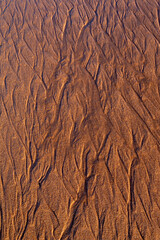 Water patterns and texture in beach sand