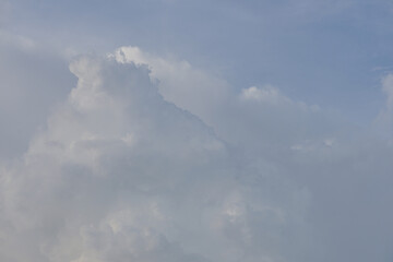 gray and white clouds are forming before a rainy on gray sky background in rainy season, rain sky