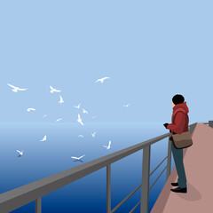 Man and birds overlooking the sea.