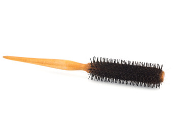 Hair brush with hair loss isolated on white.