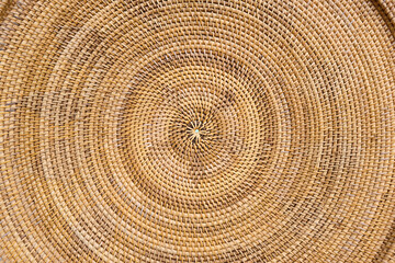 Naklejka premium Round wicker woven pattern texture or background 